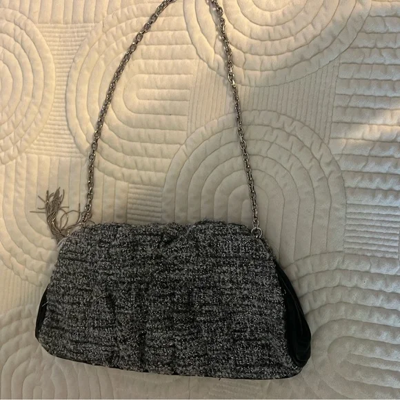 Shades of woven gray, and silver and black leather trim.Removable silver chain